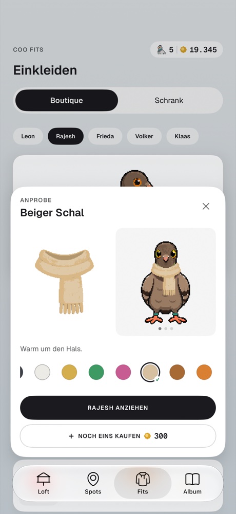 Boutique: Anprobe eines beigen Schals